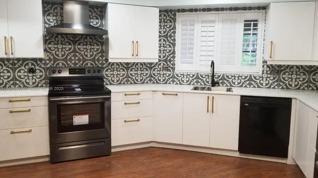 a kitchen with granite countertop a stove and a sink