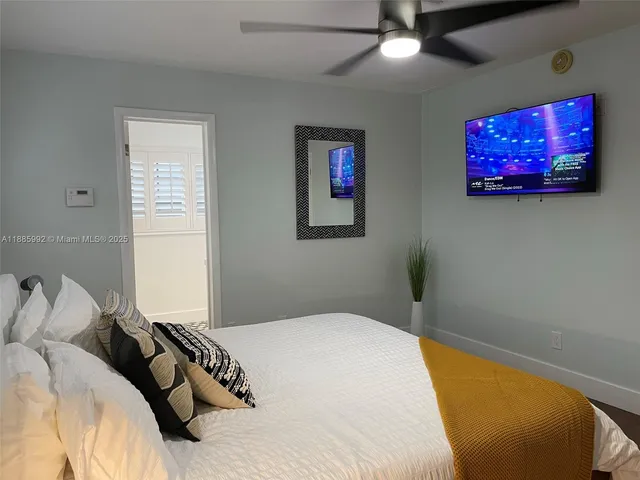 a bedroom with a bed and furniture