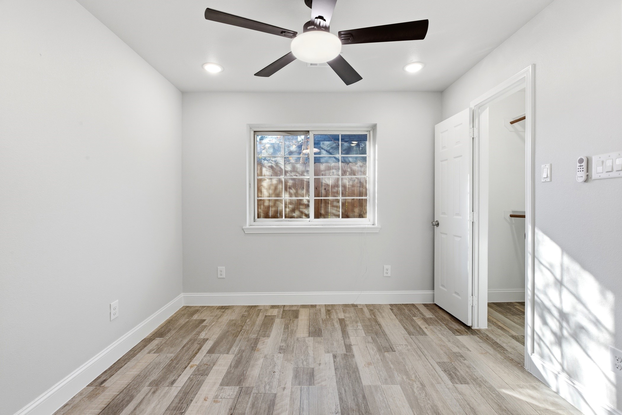 7310 Foxwaithe Lane Humble, TX 77338 - Photo 12 of 15 a view of empty room with wooden floor and fan