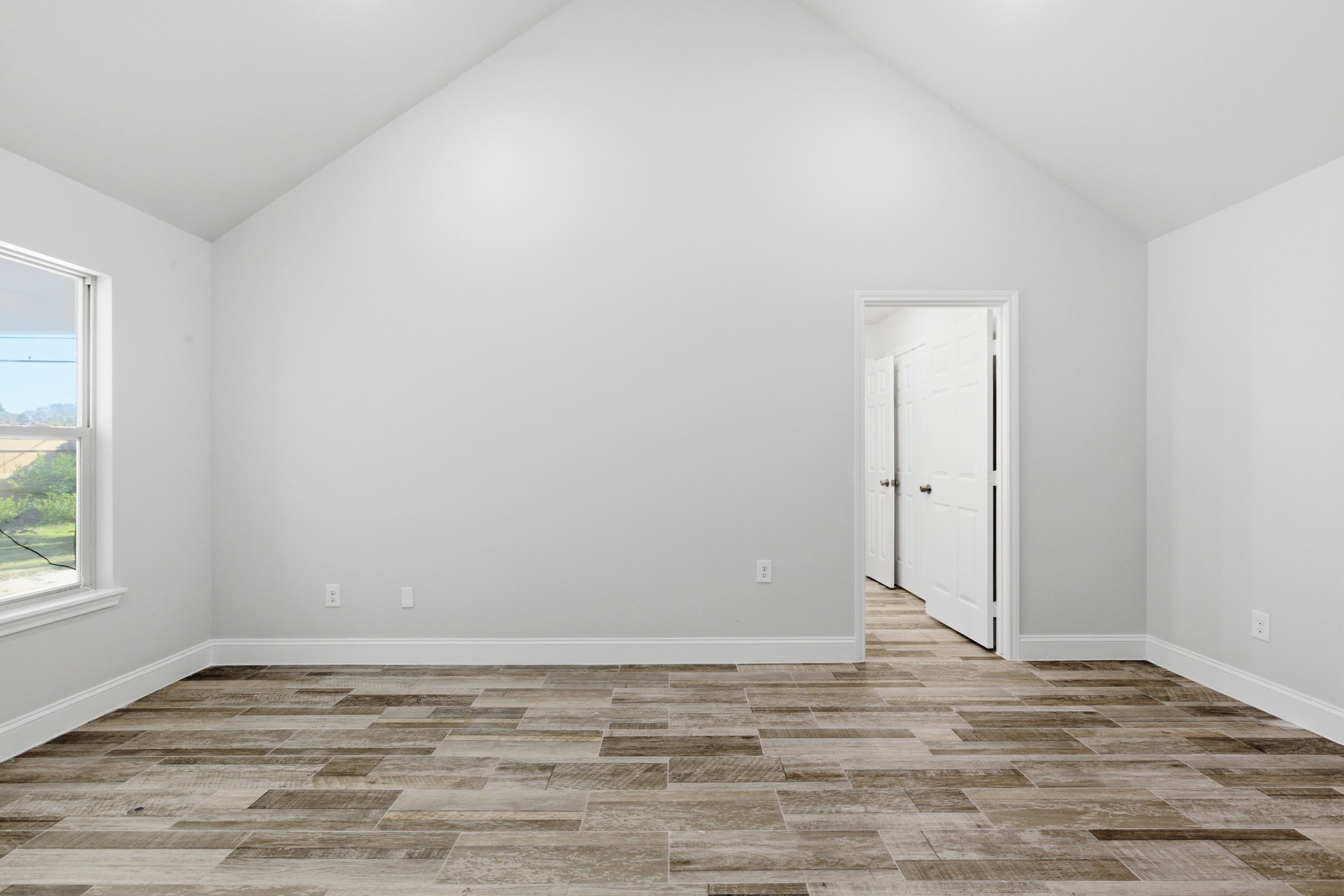7310 Foxwaithe Lane Humble, TX 77338 - Photo 8 of 15 a view of empty room with wooden floor and fan