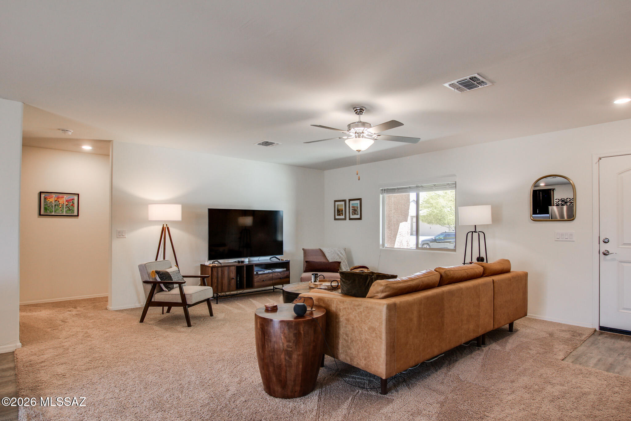 7056 South Draper Road Tucson, AZ 85757 - Photo 5 of 22 a living room with furniture and a flat screen tv