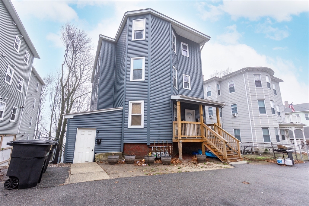 81 Merrifield Street, Unit B1 Worcester, MA 01605 - Photo 9 of 9 a front view of a house with a yard
