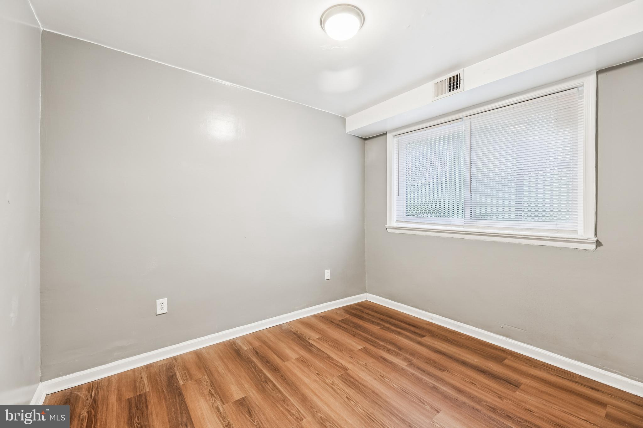 2640 Wade Road Southeast, Unit 2 Washington, DC 20020 - Photo 19 of 23 a view of a room with wooden floor and cabinet