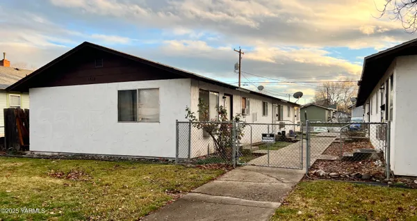 a front view of a house with basket ball court
