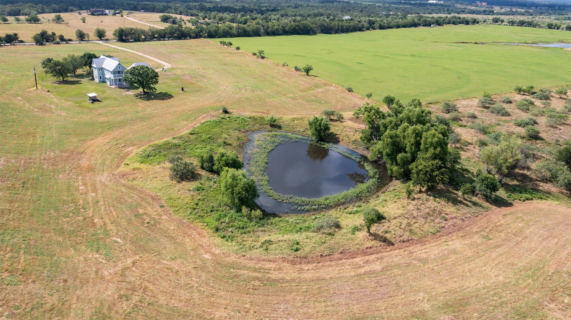 768 Upper Elgin River Road Elgin, TX 78621 - Photo 35 of 40 Aerial view of pond