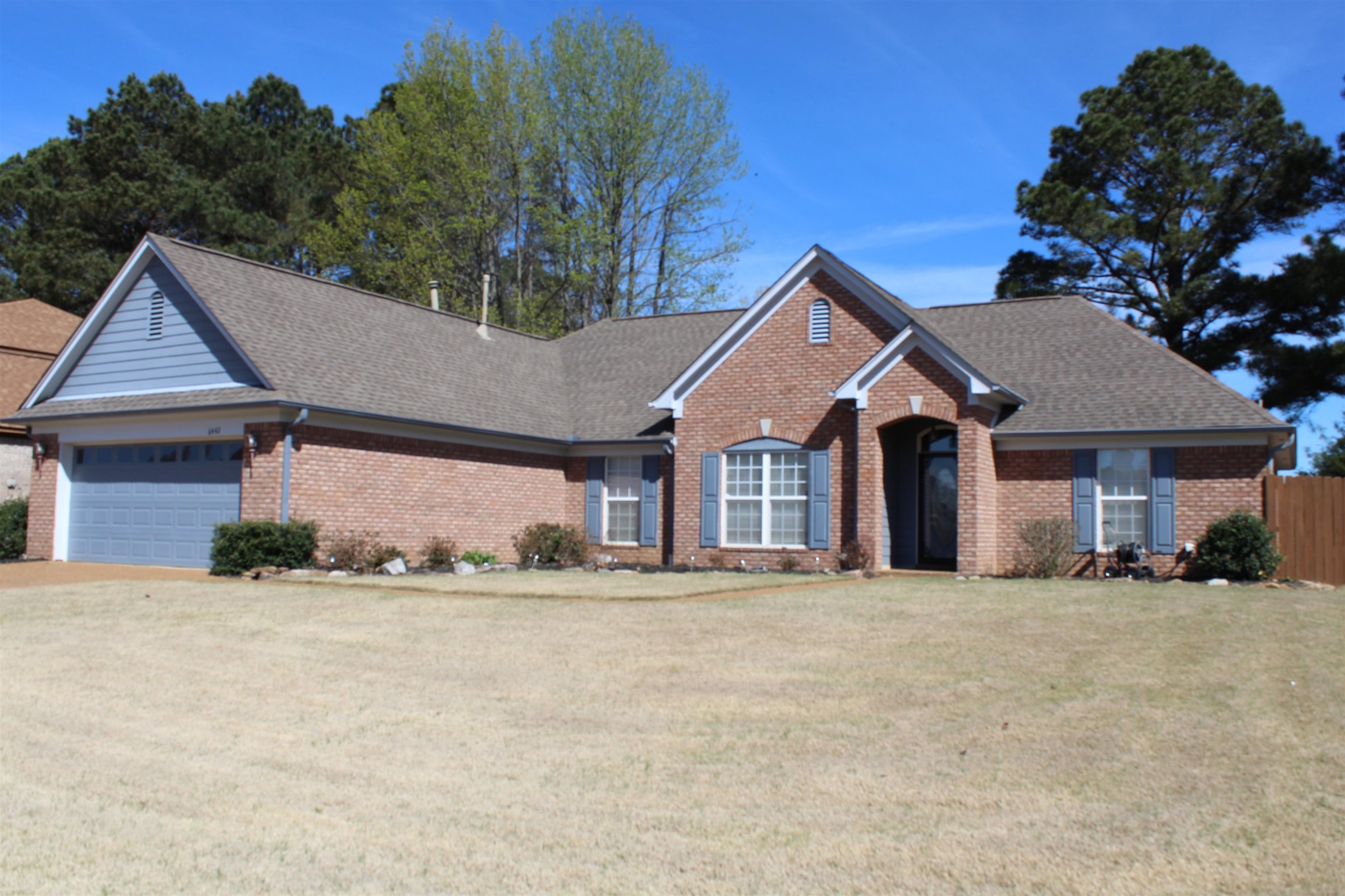6442 Bending River Road Bartlett, TN 38135 - Photo 1 of 21 a front view of a house with a yard