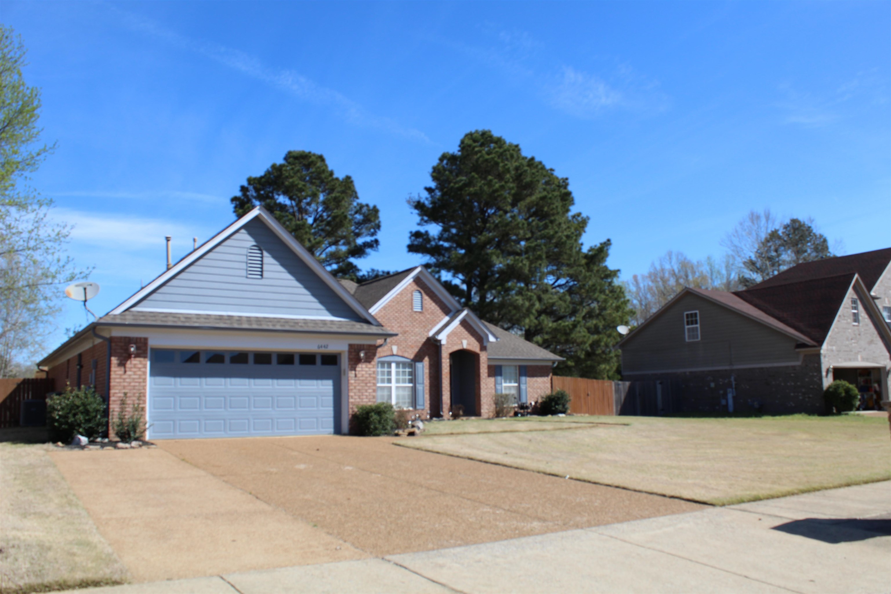 6442 Bending River Road Bartlett, TN 38135 - Photo 2 of 21 a front view of a house with a yard and garage