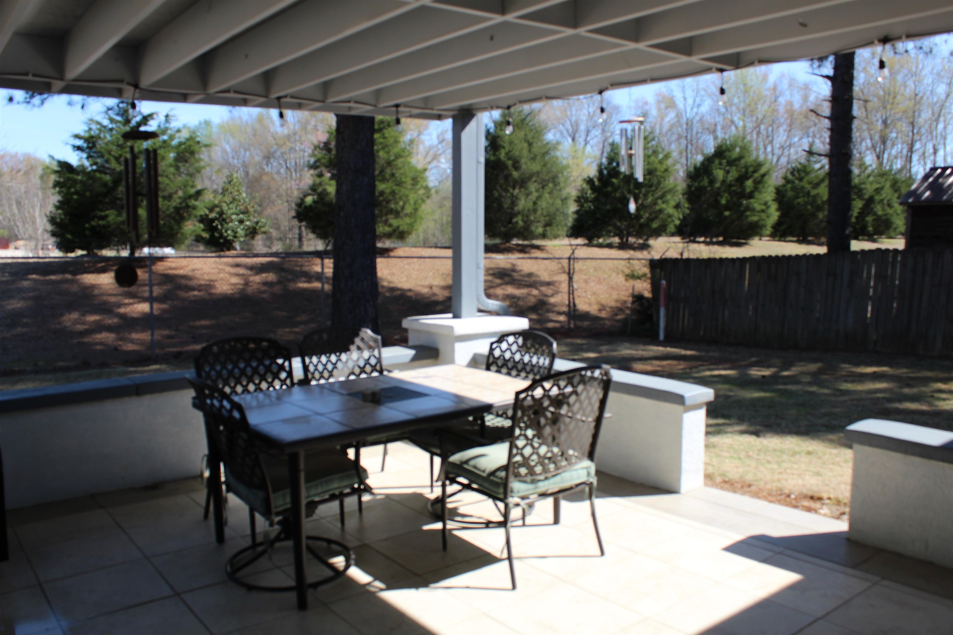 6442 Bending River Road Bartlett, TN 38135 - Photo 21 of 21 a view of a patio with a table chairs and a backyard