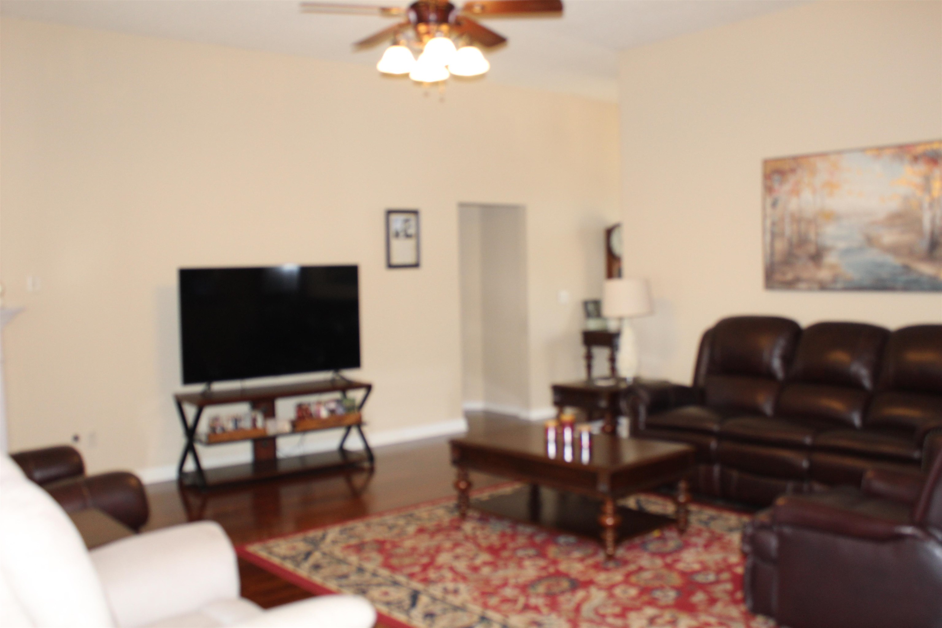 6442 Bending River Road Bartlett, TN 38135 - Photo 7 of 21 a living room with furniture and a flat screen tv