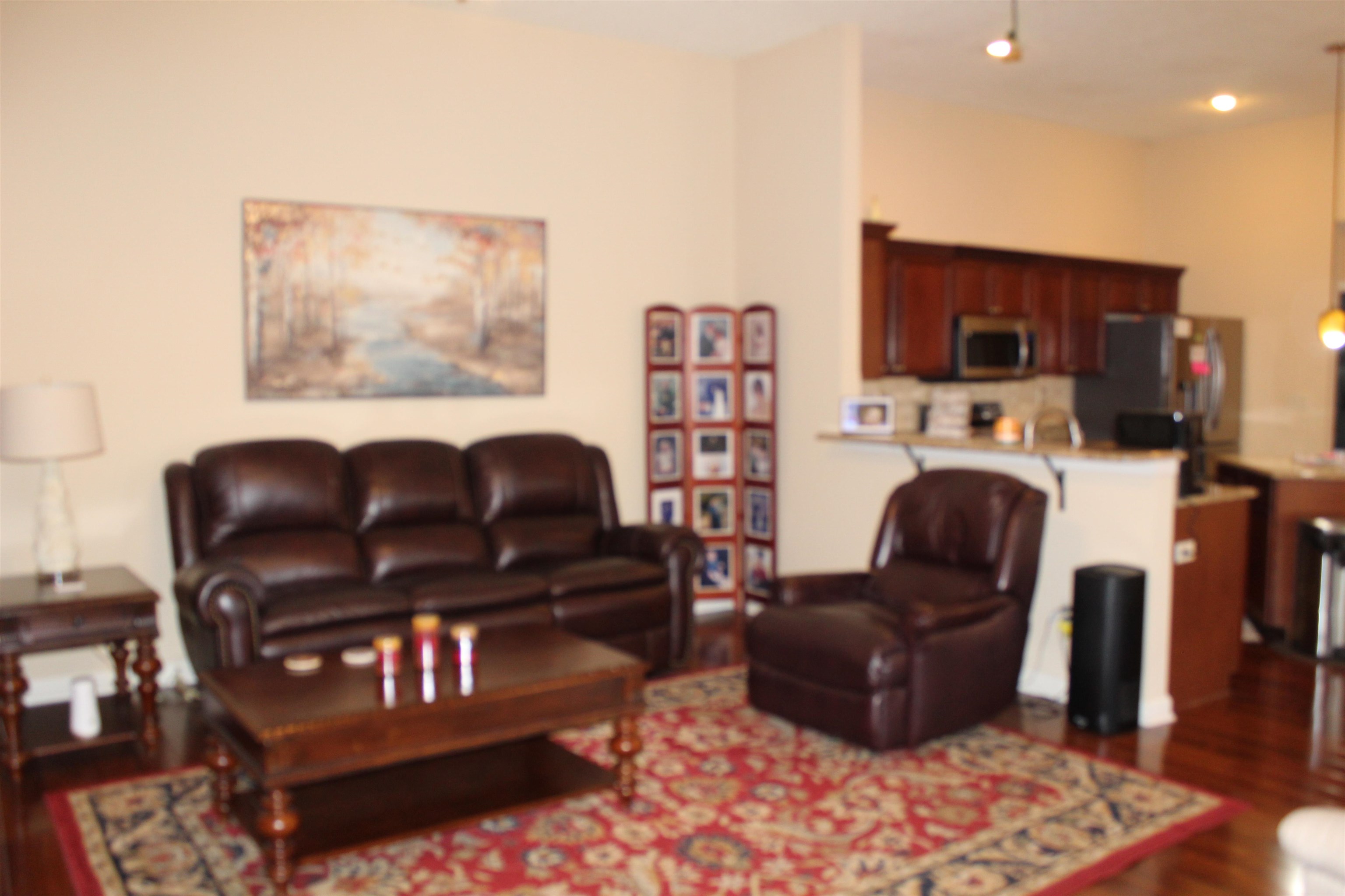 6442 Bending River Road Bartlett, TN 38135 - Photo 9 of 21 a living room with furniture a rug and a fireplace