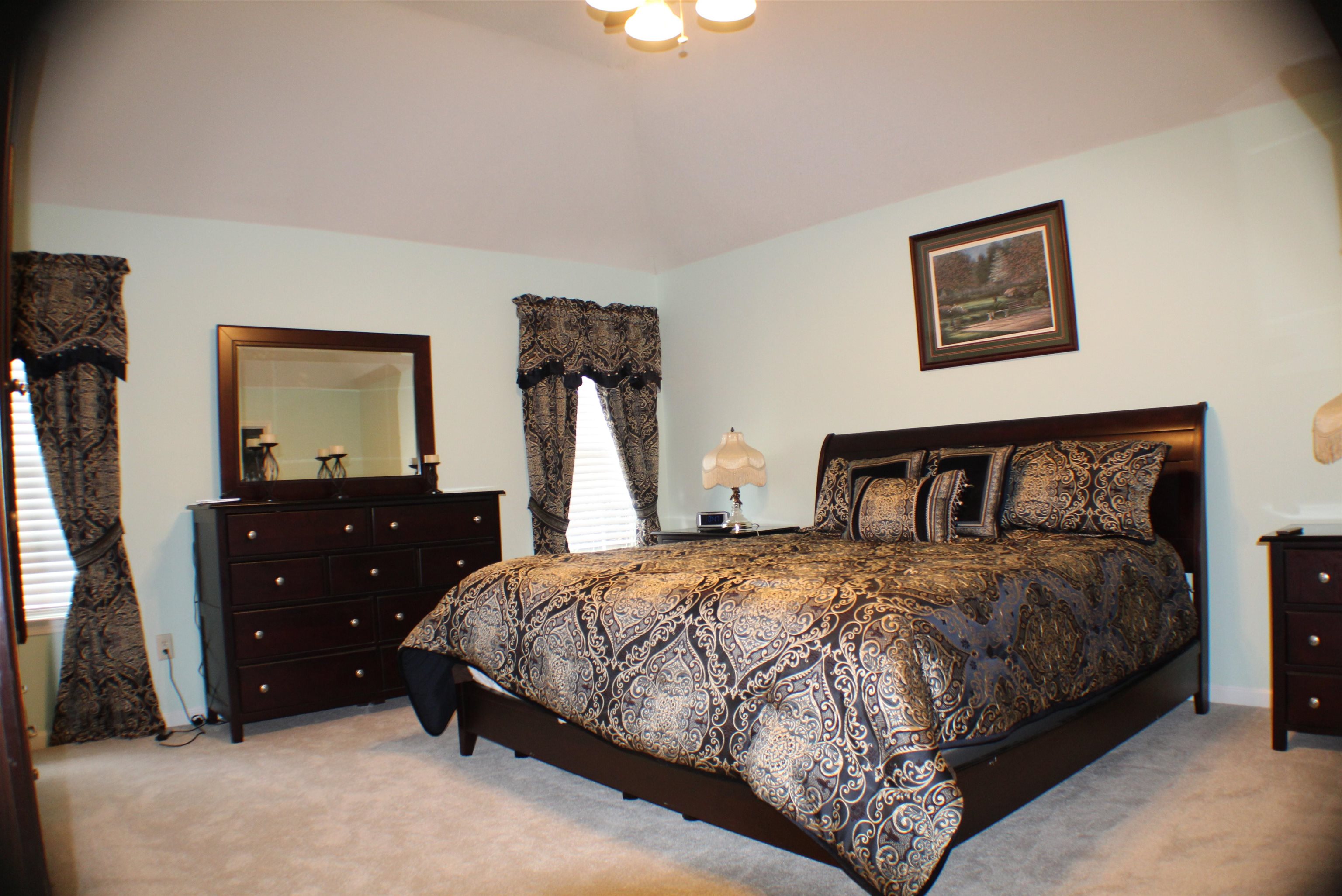 6442 Bending River Road Bartlett, TN 38135 - Photo 10 of 21 a bedroom with a bed and a flat screen tv