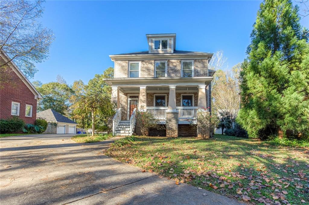 1330 Skyhaven Road Southeast Atlanta, GA 30316 - Photo 1 of 1 a front view of a house with a yard