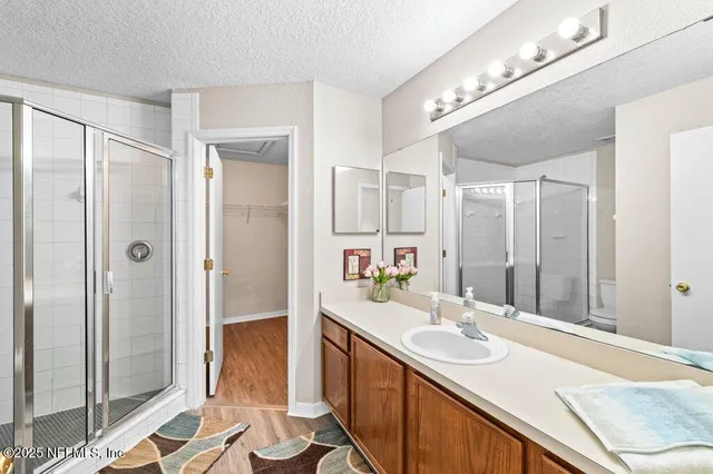 a view of a room with wooden floor