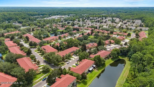 an aerial view of residential houses with outdoor space