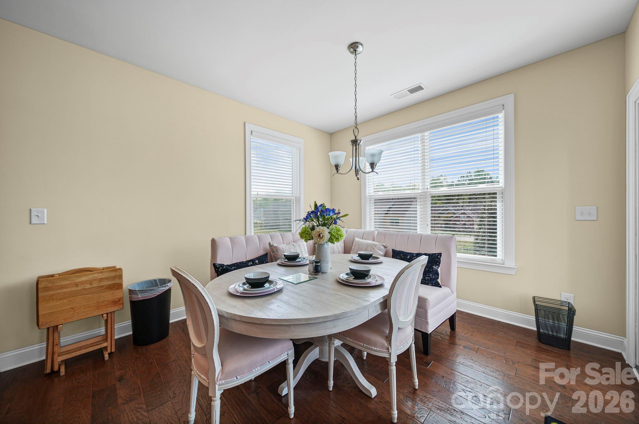 9639 Lockwood Road Concord, NC 28027 - Photo 17 of 33 a view of a dining room with furniture window and wooden floor