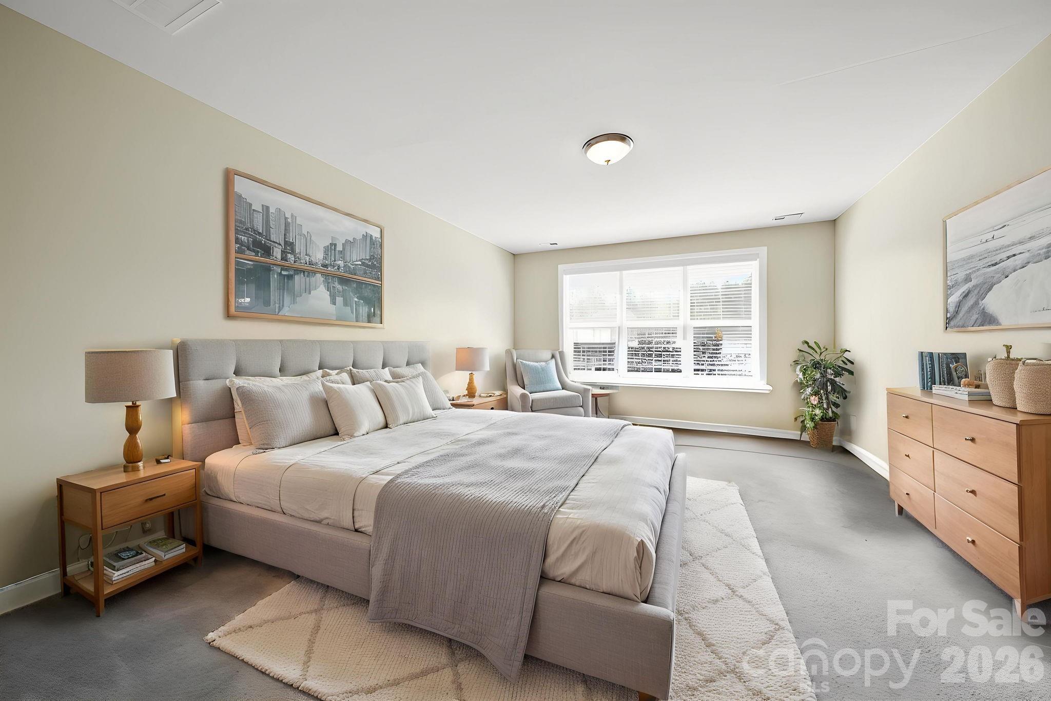 9639 Lockwood Road Concord, NC 28027 - Photo 21 of 33 a spacious bedroom with a large bed and a window