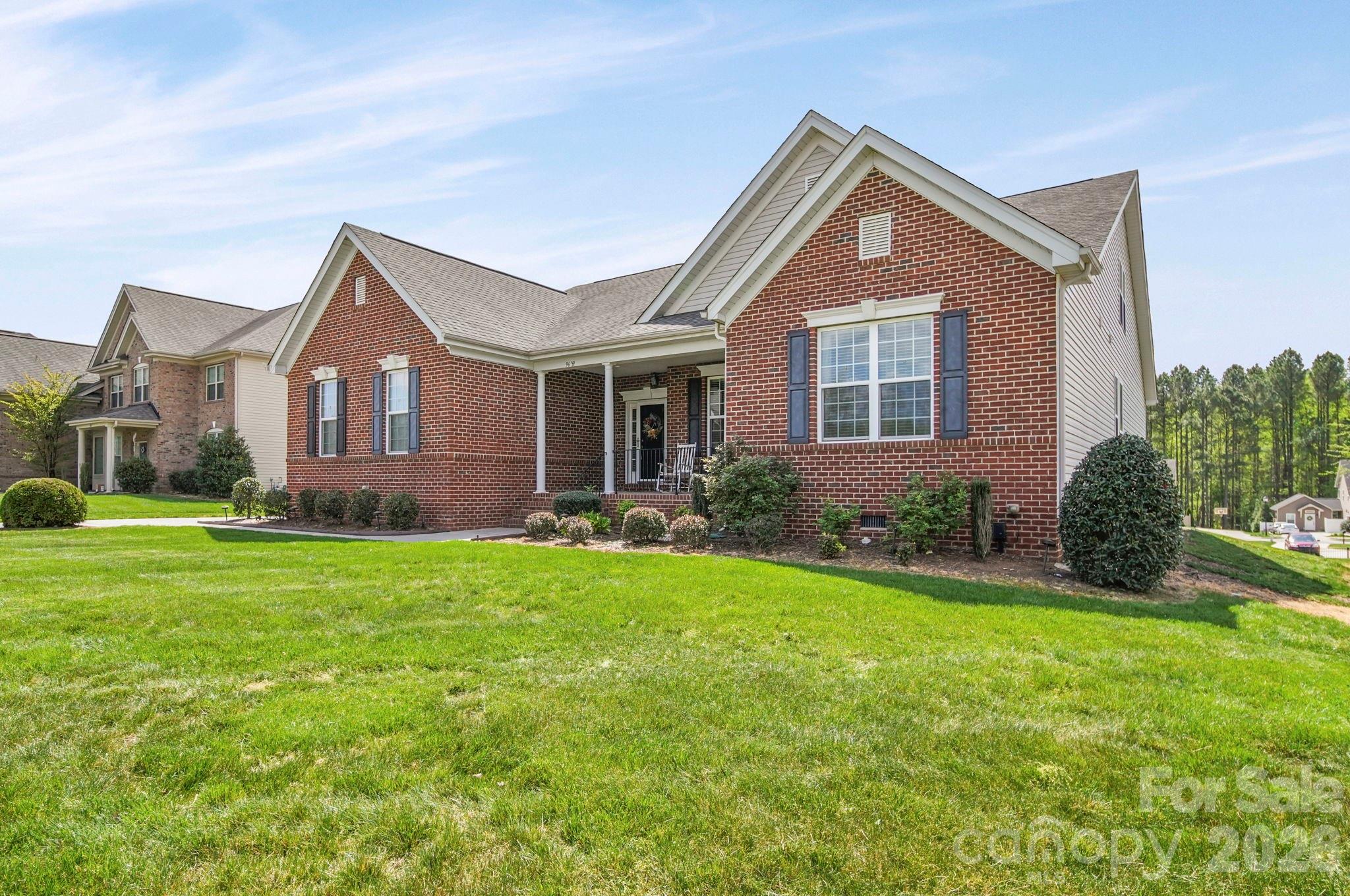9639 Lockwood Road Concord, NC 28027 - Photo 3 of 33 a front view of a house with a yard