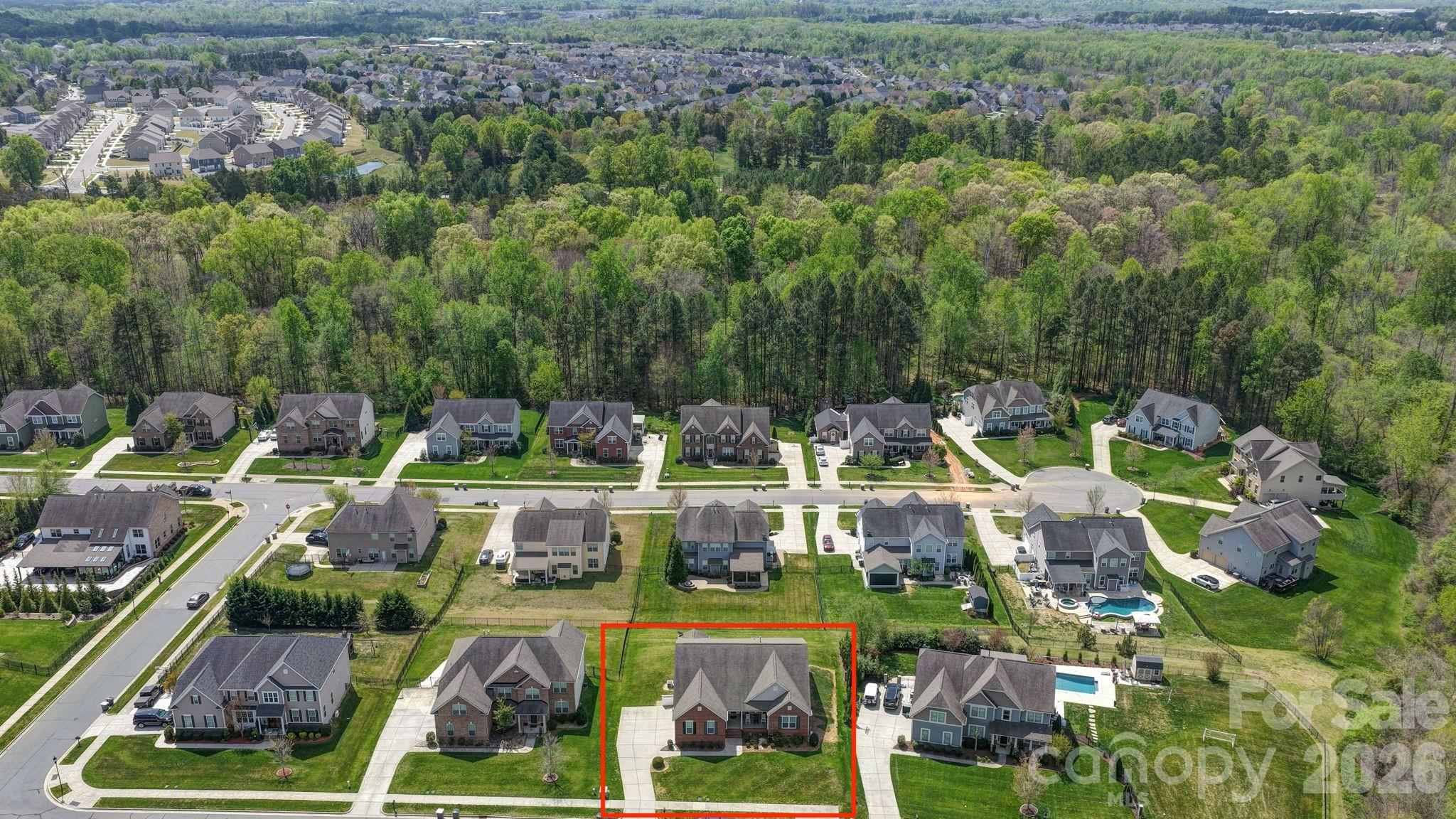 9639 Lockwood Road Concord, NC 28027 - Photo 31 of 33 an aerial view of houses with swimming pool