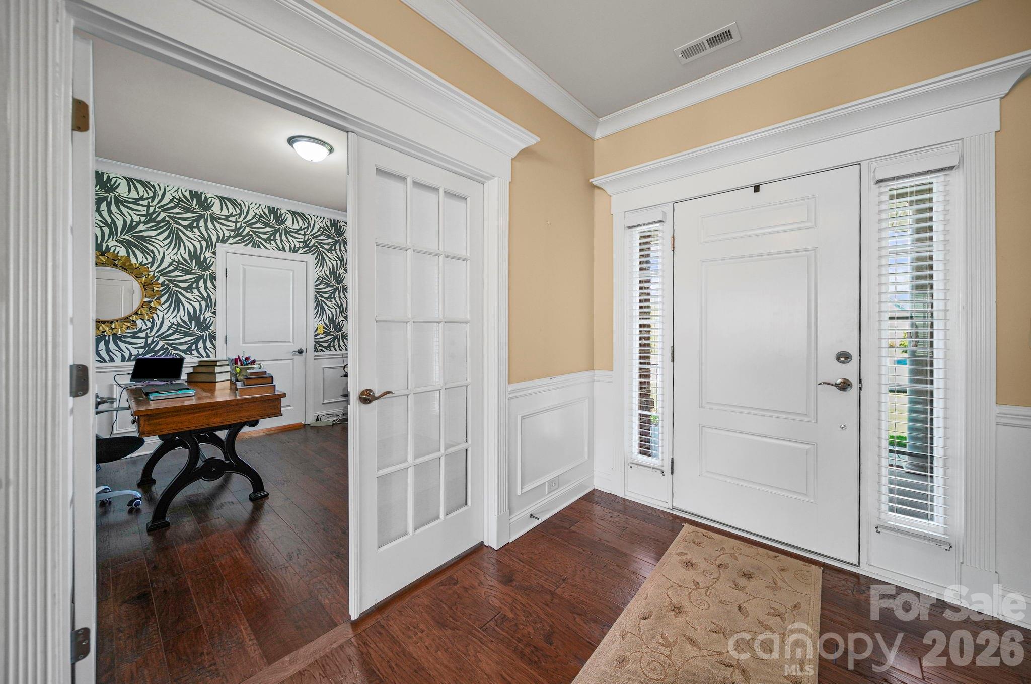 9639 Lockwood Road Concord, NC 28027 - Photo 6 of 33 a view of a room that has a bed and a table in it