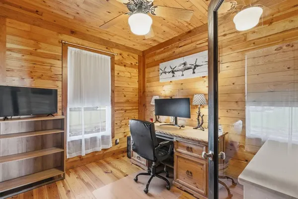 a view of a workspace with furniture