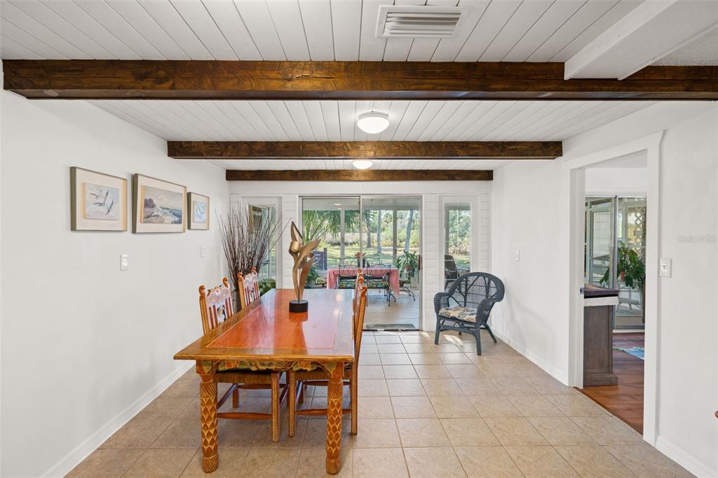 1524 Indian Bay Road Hernando Beach, FL 34607 - Photo 12 of 48 a dining room with furniture and wooden floor