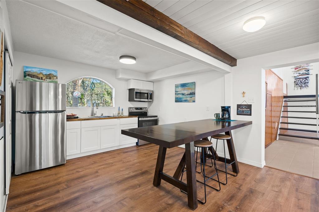 1524 Indian Bay Road Hernando Beach, FL 34607 - Photo 15 of 48 a view of a dining room with furniture window and wooden floor