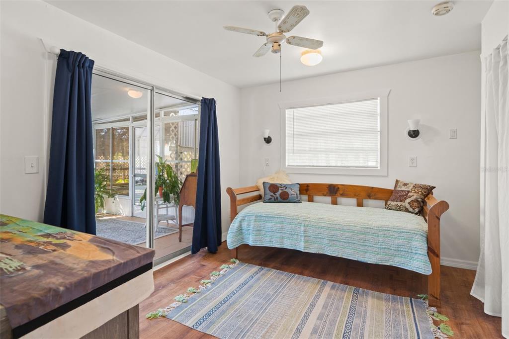 1524 Indian Bay Road Hernando Beach, FL 34607 - Photo 17 of 48 a bedroom with a bed and a large window