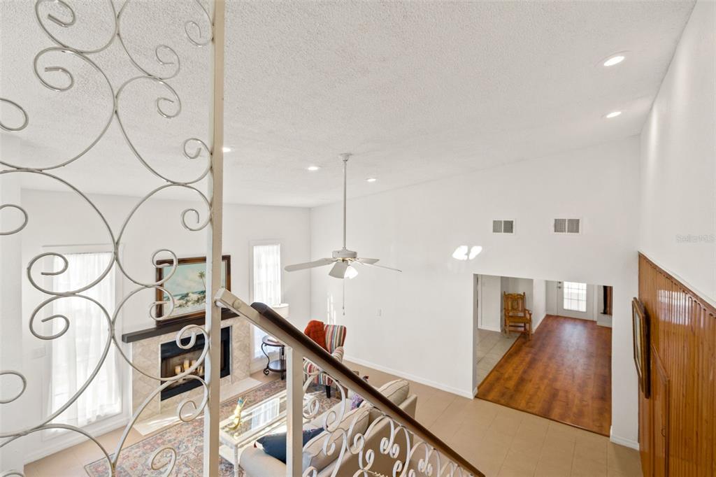1524 Indian Bay Road Hernando Beach, FL 34607 - Photo 20 of 48 a view of a hallway with wooden floor and staircase