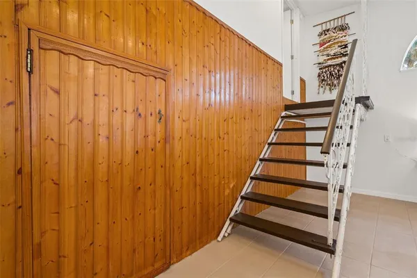a view of entryway with stairs