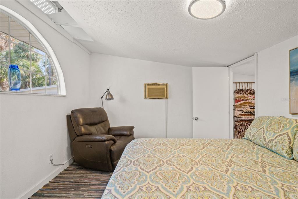 1524 Indian Bay Road Hernando Beach, FL 34607 - Photo 23 of 48 a bedroom with bed and window