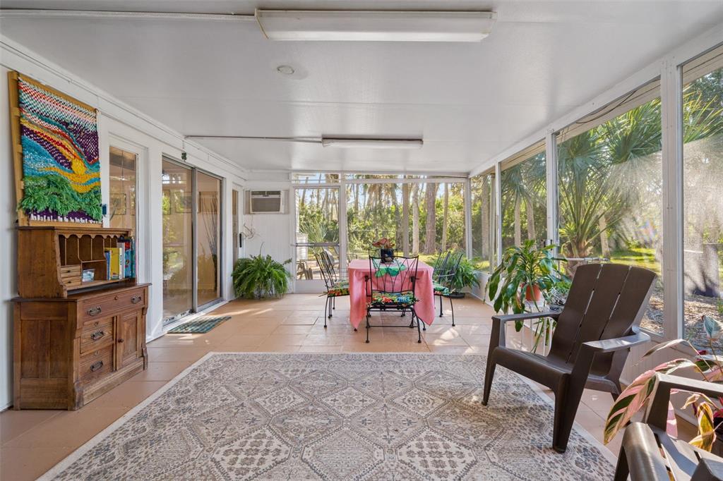 1524 Indian Bay Road Hernando Beach, FL 34607 - Photo 25 of 48 a living room filled with furniture and a potted plant