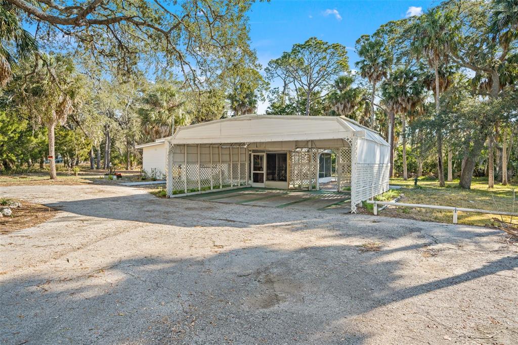 1524 Indian Bay Road Hernando Beach, FL 34607 - Photo 31 of 48 a front view of a house with a yard