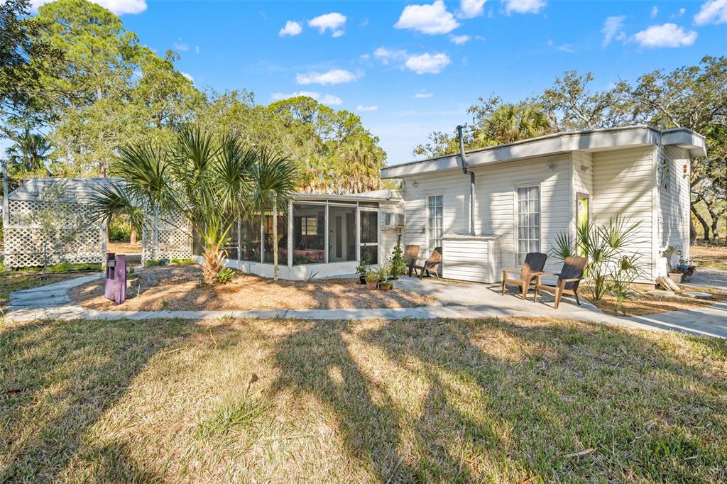 1524 Indian Bay Road Hernando Beach, FL 34607 - Photo 38 of 48 a view of a house with a yard and sitting area