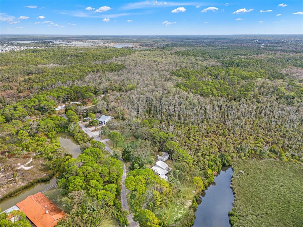 1524 Indian Bay Road Hernando Beach, FL 34607 - Photo 47 of 48 a view of a pathway both side of yard