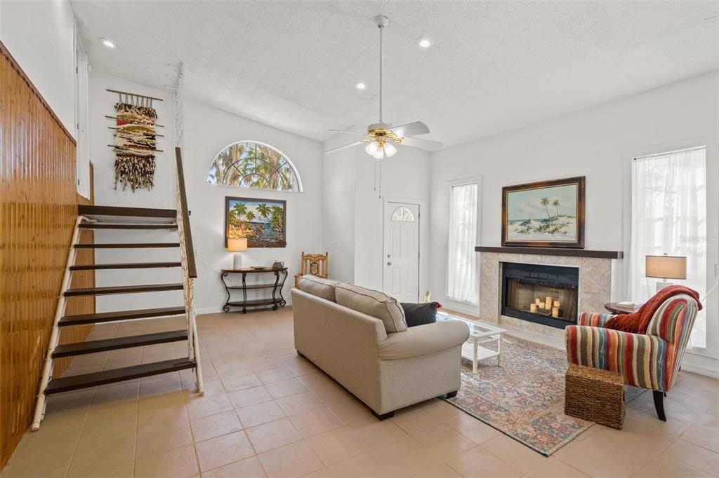 1524 Indian Bay Road Hernando Beach, FL 34607 - Photo 5 of 48 a living room with furniture and a fireplace