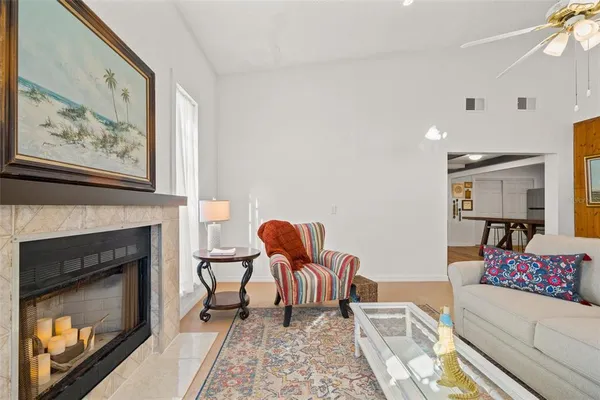 a living room with furniture and a fireplace
