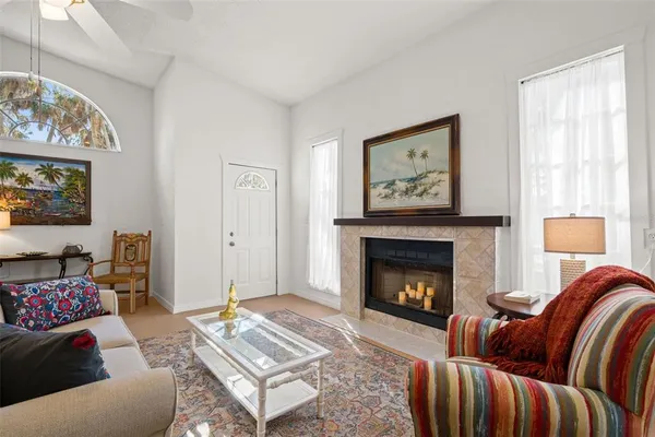 a living room with furniture and a fireplace