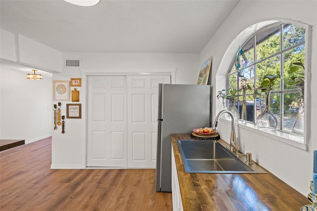 1524 Indian Bay Road Hernando Beach, FL 34607 - Photo 10 of 48 wooden floor in an empty room with a window