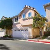 a front view of a house with yard