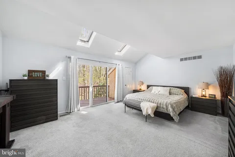 a bathroom with a double vanity sink toilet and shower