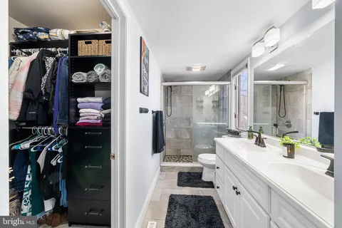 a bedroom with furniture and a chandelier