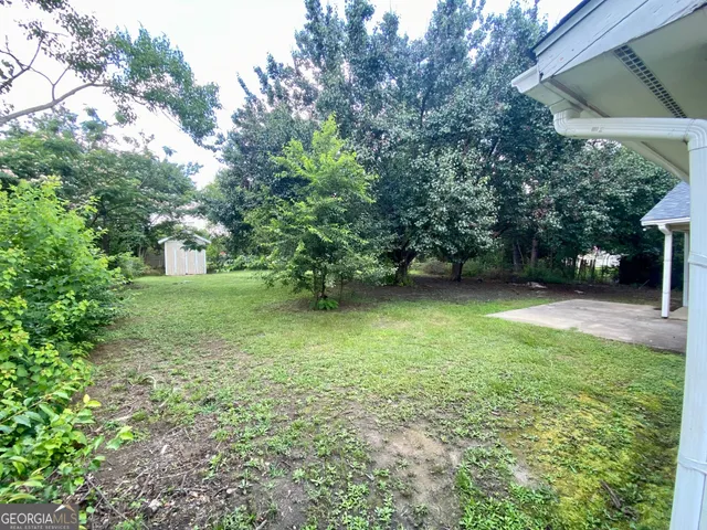 a view of a backyard with a garden