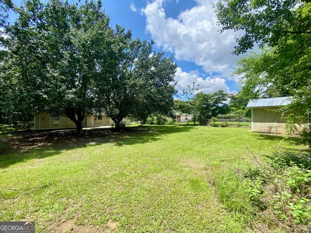 a view of backyard with green space