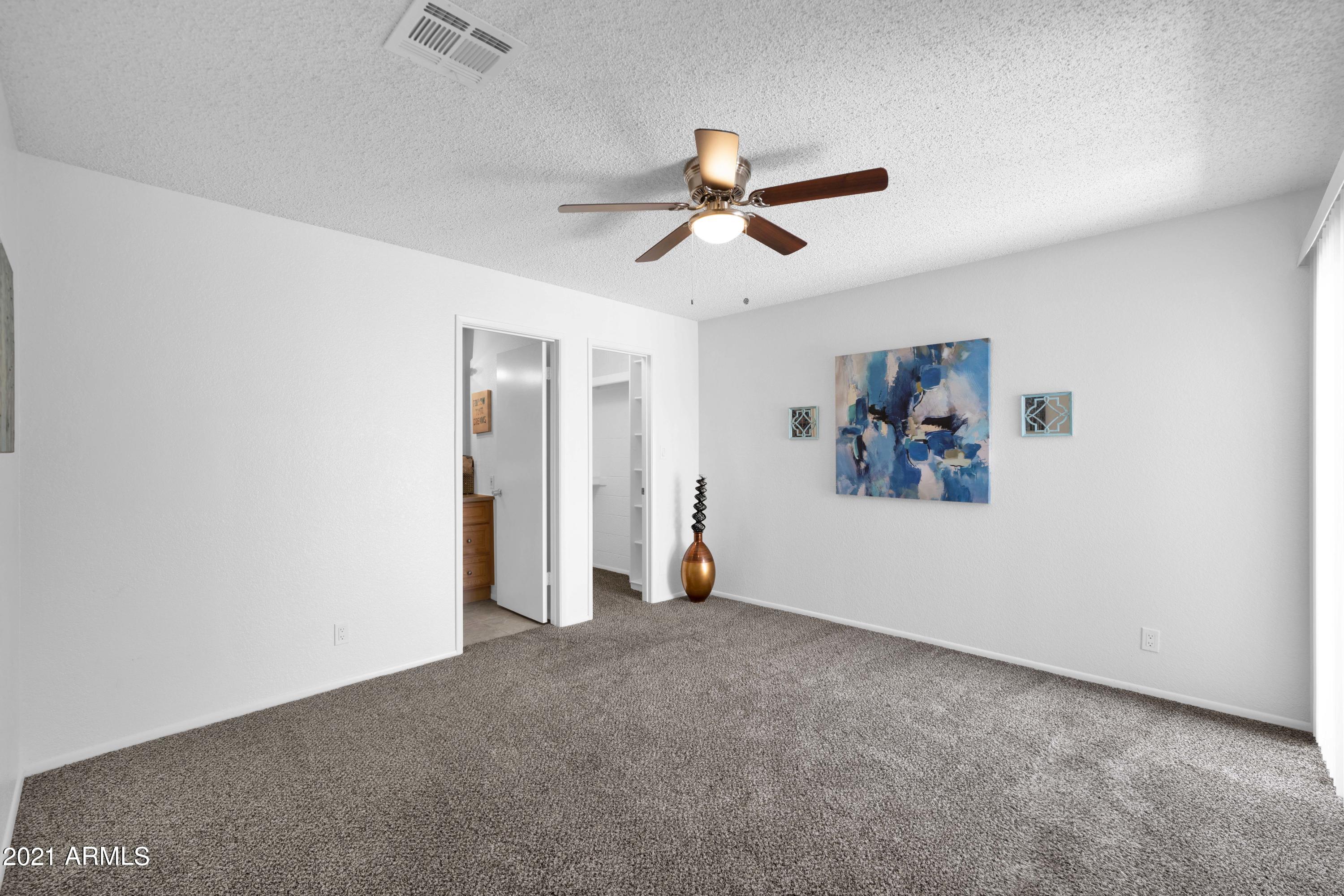 97 North Cooper Road, Unit 104 Chandler, AZ 85225 - Photo 13 of 27 wooden floor in an empty room