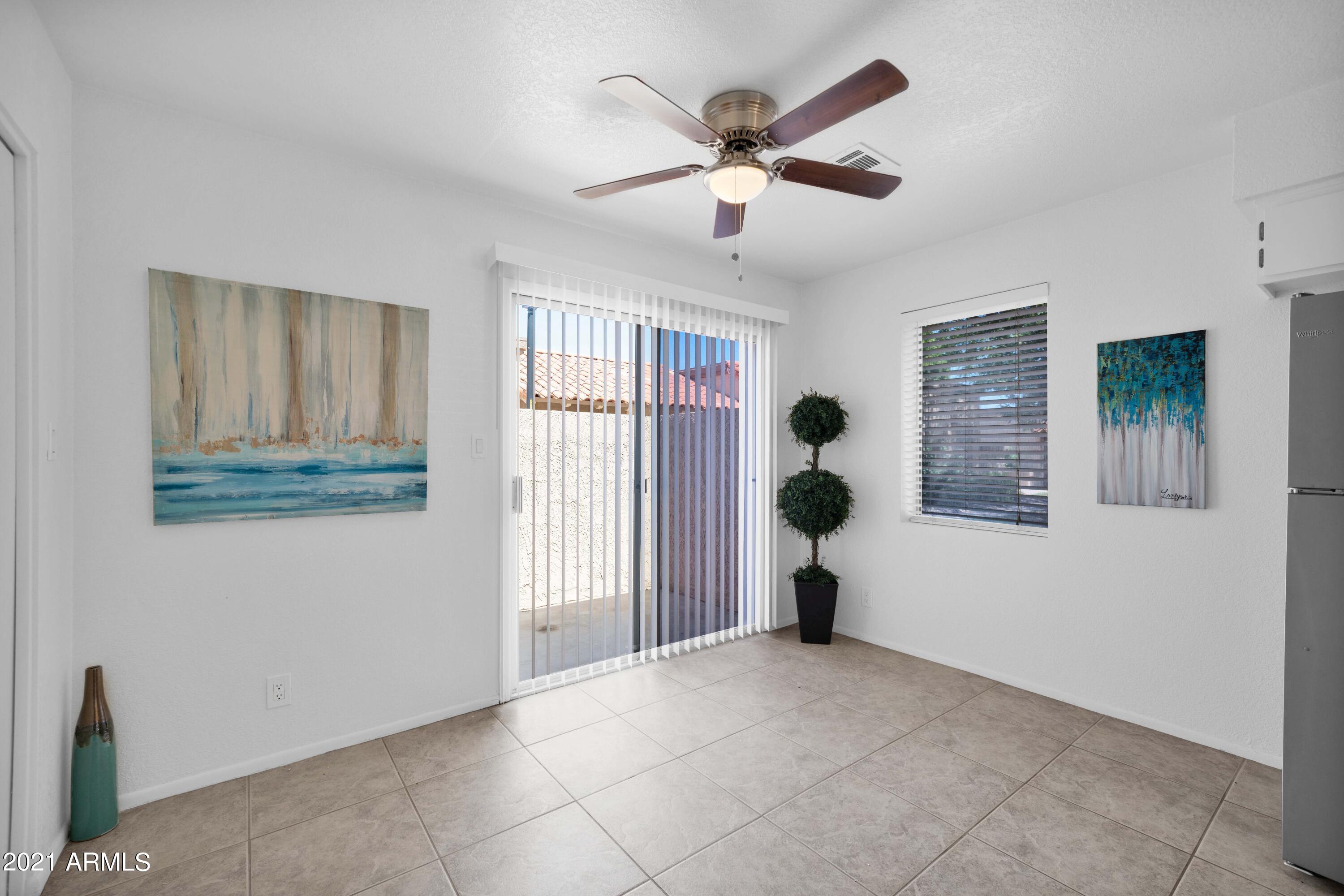 97 North Cooper Road, Unit 104 Chandler, AZ 85225 - Photo 6 of 27 a view of livingroom with furniture and windows
