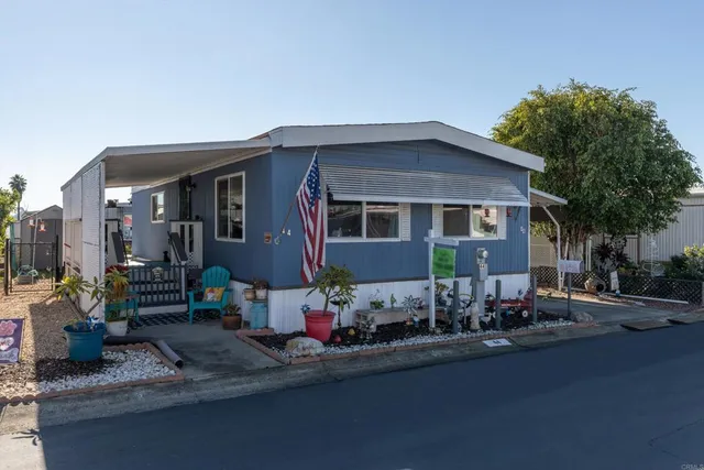 a front view of a house with sitting area