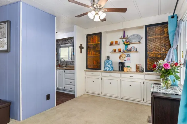 a spacious bathroom with a sink a large mirror and a shower