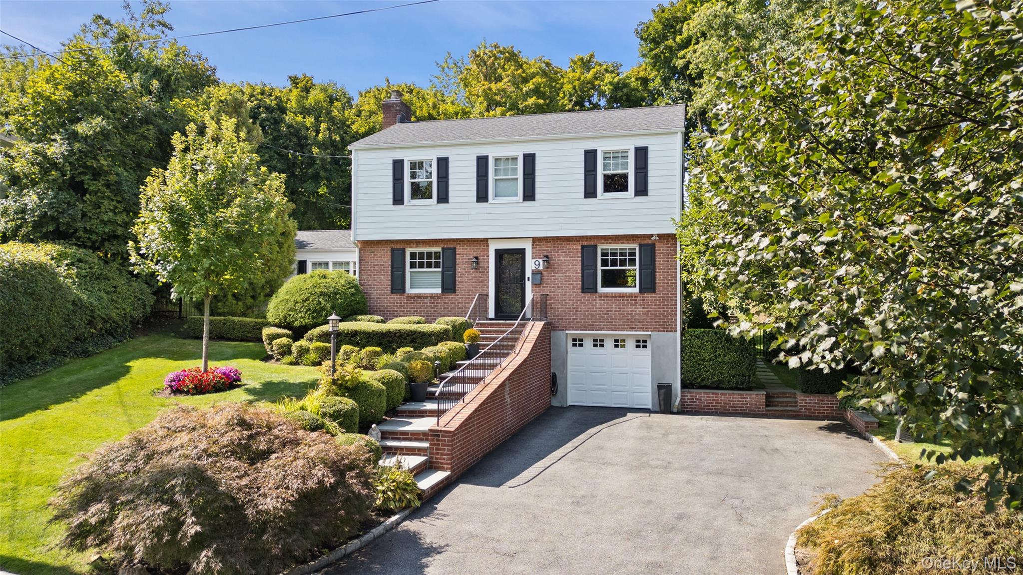 Welcome home to 9 Hazelton Drive in Scarsdale!