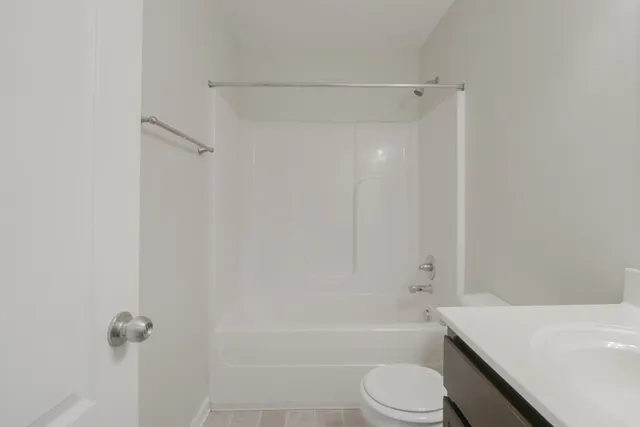 a bathroom with a bathtub toilet and sink
