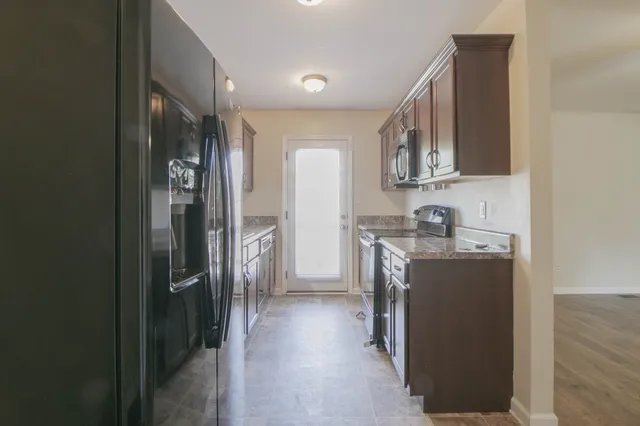 a view of a kitchen from the hallway